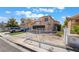 Charming two-story home with a two-car garage, low maintenance front yard, and desert landscaping at 2211 Arborwood Way, Las Vegas, NV 89142