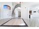 Inviting foyer with staircase, tile floors, and access to the kitchen and living areas at 2211 Arborwood Way, Las Vegas, NV 89142