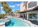 Backyard pool with a jacuzzi and covered patio at 2211 Arborwood Way, Las Vegas, NV 89142