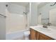 Neat bathroom features a shower-tub combo, single sink, and ample counter space at 2324 Willow Wren Dr, North Las Vegas, NV 89084