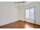 Cozy bedroom featuring hardwood floors, ceiling fan, and natural light at 2324 Willow Wren Dr, North Las Vegas, NV 89084