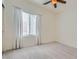 Comfortable bedroom with plush carpeting, a ceiling fan, and large window at 2324 Willow Wren Dr, North Las Vegas, NV 89084