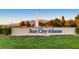 The Sun City Aliante community sign with landscaping and a water feature with mountains in the background at 2324 Willow Wren Dr, North Las Vegas, NV 89084