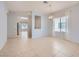 Bright dining room featuring tile flooring and modern chandelier at 2324 Willow Wren Dr, North Las Vegas, NV 89084