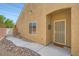 Inviting home entrance with a charming front door, walkway, and desert landscaping at 2324 Willow Wren Dr, North Las Vegas, NV 89084