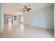 Open living room area with tile floors, ceiling fan, and ample natural light throughout at 2324 Willow Wren Dr, North Las Vegas, NV 89084