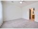 Spacious carpeted bedroom with attached bathroom, closet and ceiling fan at 2324 Willow Wren Dr, North Las Vegas, NV 89084