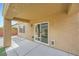 Covered patio with sliding door and clean concrete flooring at 2324 Willow Wren Dr, North Las Vegas, NV 89084