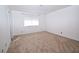 This bedroom has neutral carpet and a window for natural light at 2431 Old Forge Ln # 101, Las Vegas, NV 89121