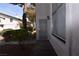 A welcoming entryway with a gated entrance and trimmed landscaping at 2431 Old Forge Ln # 101, Las Vegas, NV 89121