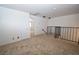 The loft features neutral carpet, a railing, and an overhead light at 2431 Old Forge Ln # 101, Las Vegas, NV 89121