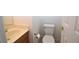 This half bath includes a vanity with sink and toilet at 2431 Old Forge Ln # 101, Las Vegas, NV 89121