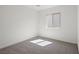 A bright bedroom offers neutral carpet, light walls, and a window that streams in natural light at 2618 Lily Point St, Las Vegas, NV 89156