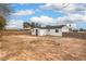 Expansive backyard surrounded by a block wall, showcasing the detached building's exterior at 2621 Bello Dr, North Las Vegas, NV 89030