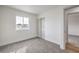 A bright bedroom features plush carpeting, and a window with an exterior view at 2621 Bello Dr, North Las Vegas, NV 89030