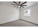 This bedroom is light and airy, has a ceiling fan, window and carpeting at 2621 Bello Dr, North Las Vegas, NV 89030