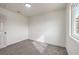 Clean-looking carpeted bedroom with a door, recessed lighting, and a window at 2621 Bello Dr, North Las Vegas, NV 89030