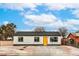 Charming single-story home with a yellow front door, gravel landscaping, and a well-maintained exterior at 2621 Bello Dr, North Las Vegas, NV 89030