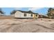 Single-story home featuring a yellow front door, gravel landscaping, and a fenced backyard for added privacy at 2621 Bello Dr, North Las Vegas, NV 89030