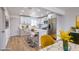 Bright kitchen featuring white cabinets, stainless steel appliances, an island with seating, and modern decor at 2621 Bello Dr, North Las Vegas, NV 89030