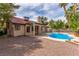 Inviting backyard with a sparkling pool and a covered patio, perfect for outdoor entertaining at 2842 Mahogany Grove Ave, Henderson, NV 89074