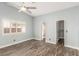 A bright bedroom with a large window, ceiling fan, and neutral colors for a relaxing space at 2842 Mahogany Grove Ave, Henderson, NV 89074