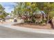 Charming single-story home featuring desert landscaping, red tile roof, and a two-car garage at 2842 Mahogany Grove Ave, Henderson, NV 89074