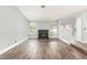 Spacious living room features wood floors, a brick fireplace, and an open layout at 2842 Mahogany Grove Ave, Henderson, NV 89074