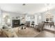Bright living room with a cozy fireplace, neutral paint, and an open floor plan great for entertaining at 2842 Mahogany Grove Ave, Henderson, NV 89074