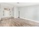 Open-concept living room featuring wood flooring, high ceilings, and a large doorway at 2842 Mahogany Grove Ave, Henderson, NV 89074