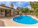 Beautiful backyard oasis with a pool, spa, and a covered patio, perfect for outdoor entertaining at 2842 Mahogany Grove Ave, Henderson, NV 89074