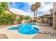 Inviting backyard featuring a kidney-shaped pool, spa, mature landscaping, and a covered patio at 2842 Mahogany Grove Ave, Henderson, NV 89074