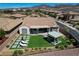 Aerial view of a private backyard with a patio, green space, and an outdoor structure at 2913 Grande Arch St, Henderson, NV 89044