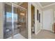 This bathroom features a walk-in shower with attractive tile and a glass door at 2913 Grande Arch St, Henderson, NV 89044