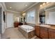 Luxurious bathroom featuring a soaking tub, double vanity, and granite countertops at 2913 Grande Arch St, Henderson, NV 89044