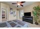 Comfortable bedroom features a ceiling fan, ensuite bath, and ample natural light from large windows at 2913 Grande Arch St, Henderson, NV 89044
