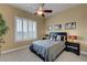 This bedroom features neutral paint, bright windows, and modern decor at 2913 Grande Arch St, Henderson, NV 89044