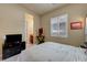 This bedroom has neutral paint, bright windows, and carpet at 2913 Grande Arch St, Henderson, NV 89044