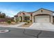 Charming single-story home featuring a well-manicured yard and two-car garage at 2913 Grande Arch St, Henderson, NV 89044