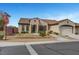 Charming single-story home with a tile roof, well-manicured landscaping, and a two-car garage at 2913 Grande Arch St, Henderson, NV 89044