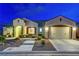 Charming single-story home featuring a well-manicured front yard and a two-car garage at 2913 Grande Arch St, Henderson, NV 89044