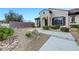 Close up of the home's front yard, showcasing the desert landscaping and inviting entryway at 2913 Grande Arch St, Henderson, NV 89044