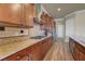 Gourmet kitchen featuring granite countertops, wood cabinets, and stainless steel appliances at 2913 Grande Arch St, Henderson, NV 89044