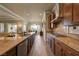 Gourmet kitchen featuring granite countertops, wood cabinets, and stainless steel appliances at 2913 Grande Arch St, Henderson, NV 89044