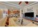 Spacious living room with open floor plan, kitchen bar seating, and modern furniture offers comfortable living at 2913 Grande Arch St, Henderson, NV 89044