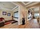 Open living space with adjacent movie room; hardwood floors and modern furnishings throughout at 2913 Grande Arch St, Henderson, NV 89044