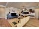 Bright living room featuring a comfortable sofa and hardwood floors at 2913 Grande Arch St, Henderson, NV 89044