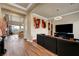 Open concept living room boasts hardwood floors, modern lighting, and access to a balcony with stunning views at 2913 Grande Arch St, Henderson, NV 89044