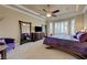 Spacious main bedroom with a ceiling fan, large windows, and ample closet space at 2913 Grande Arch St, Henderson, NV 89044