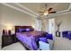 Spacious main bedroom featuring a ceiling fan, large windows, and ample closet space at 2913 Grande Arch St, Henderson, NV 89044
